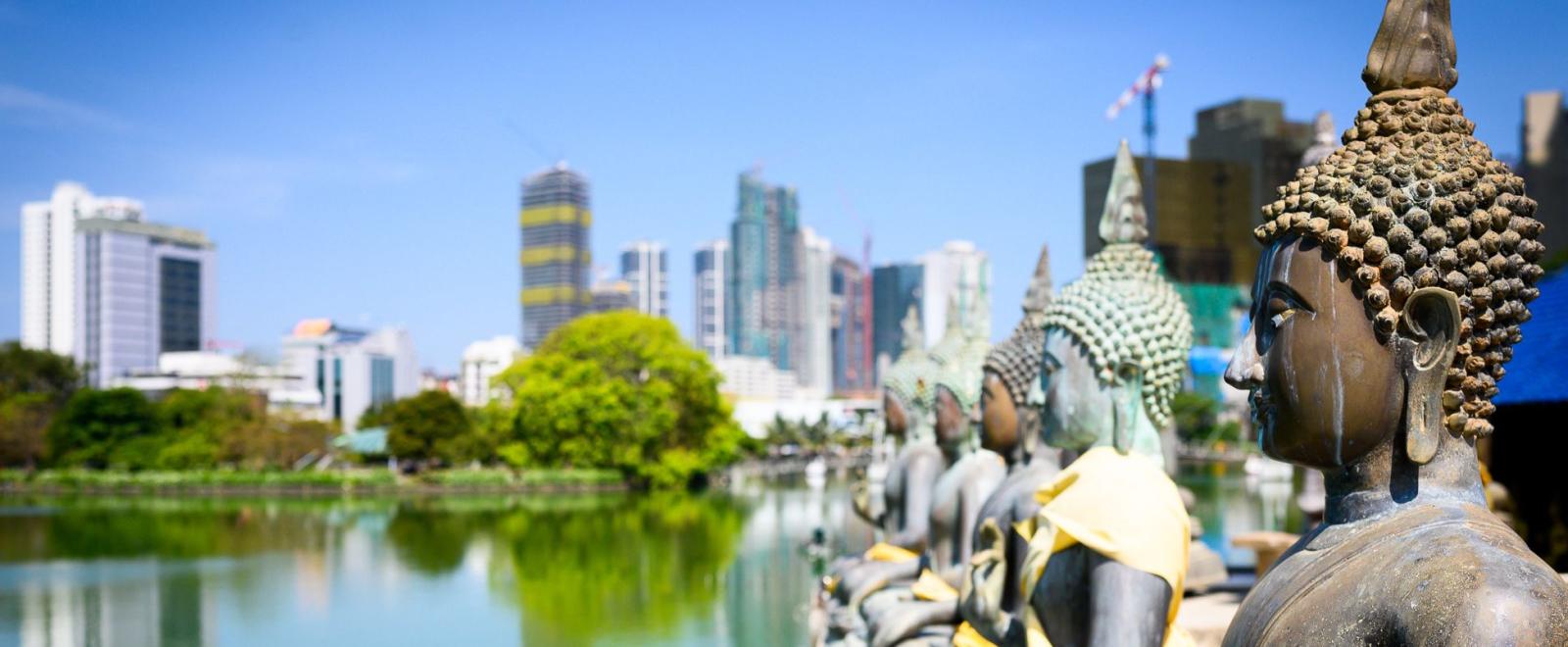 A group of volunteers in Sri Lanka go sightseeing at a buddhist temple in Colombo.